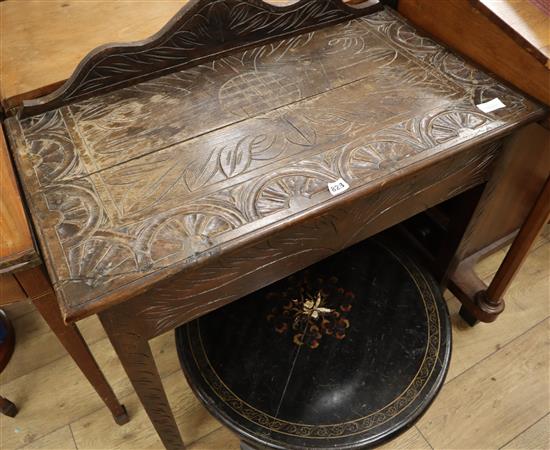 A late 19th century carved oak side table W.90cm